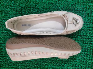 like new cream and golden belly shoe