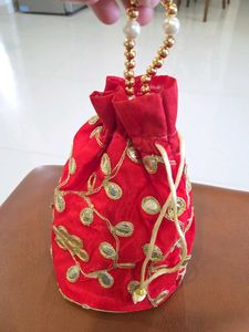 Red Potli Bag with Gold Embellishments