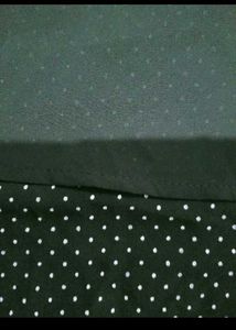 Chic Black Sleeveless Top with Polka Dot Hem