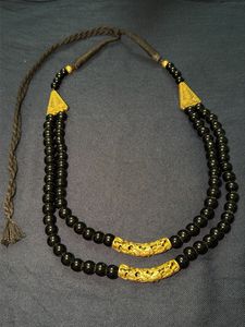 Black beads and golden finish costume jewellery