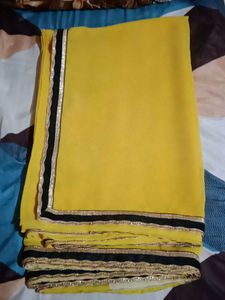 Vibrant Yellow Saree with Black & Gold Border