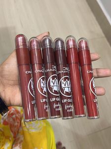matte liquid lipstick with lip cryon on tip.