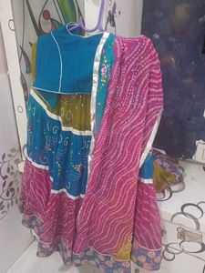 1) Royal Blue Lehenga Choli with Red Dupatta.  2)