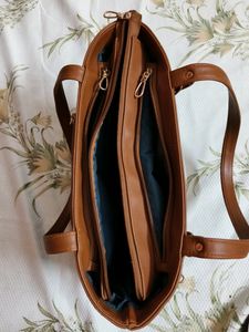 "Carry your essentials in style with this Handbag"