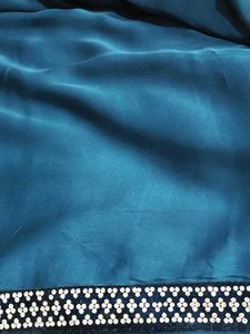 Elegant Teal Saree with Embellished Border