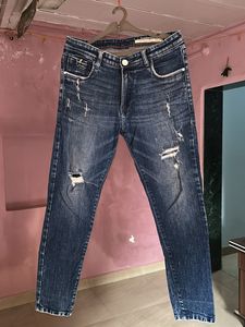 Distressed Blue Denim Jeans by Par Swan