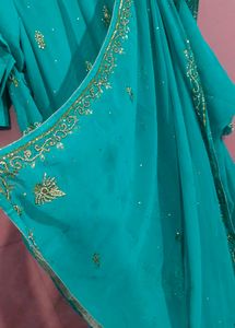 Exquisite Teal Saree with Intricate Gold Embellish