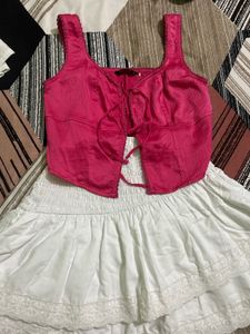 Chic Pink Lace-Up Crop Top with white skirt
