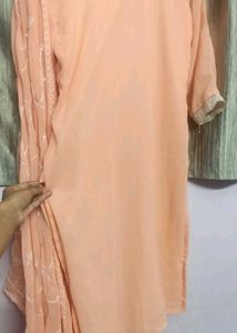 orange kurta set with beads work
