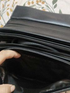 Chic Black Handbag with Buckle Detail