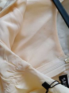 Cream Off-Shoulder Jumpsuit with Tie-Up Sleeves