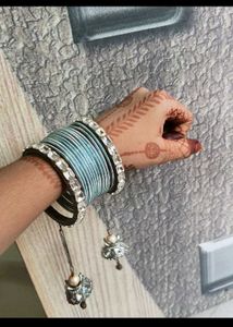 Elegant Stack of Blue Bangles with Charms