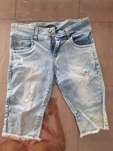 Distressed Light Wash Denim Capris