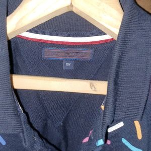 Tommy Hilfiger custom polo t-shirt for Boys, age 6 to 7yrs. black color with color full lines.