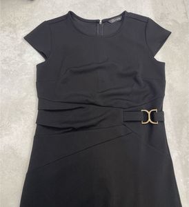 Chic Black Dress with Gold Accent