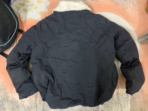 Black Puffer Jacket Had Adjustable Knot At The