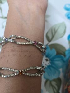 Silver colouring bangles with colorful stones.