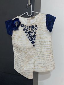 Elegant White Top with Blue Lace Sleeves