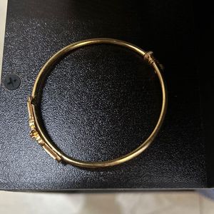 Elegant Gold Bracelet with Red Stone