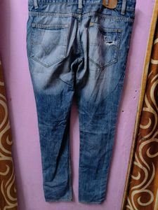 Distressed Blue Denim Jeans
