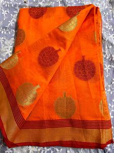 Vibrant Orange Saree with Leaf Motifs