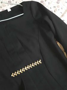 Elegant Black Peplum Top with Embellishments