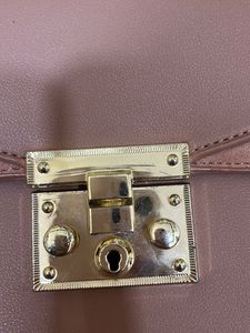 beige sling bag
