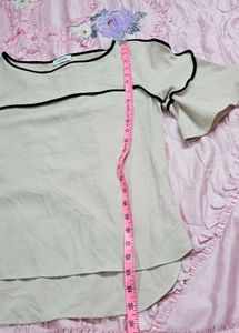 Calvin Klein Women's soft pink hue or light cream.