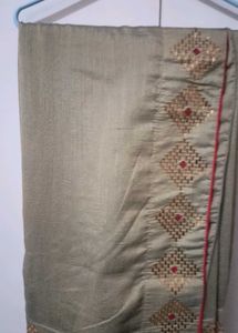 Elegant Beige Saree with Gold Embellishments