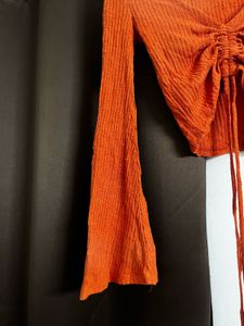 rust orange flared sleeve top
