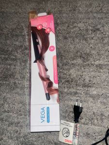 Vega I-Curl hair curler with a 0.5-1 inch tapered