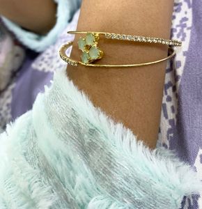 Elegant Gold-Tone Bangle with Gemstones