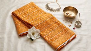 Vibrant Orange Embroidered  Saree
