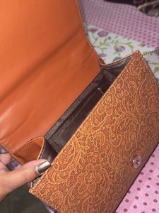 Elegant Embossed Clutch and sling bag