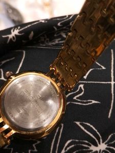 Elegant Gold Watch with Green Dial