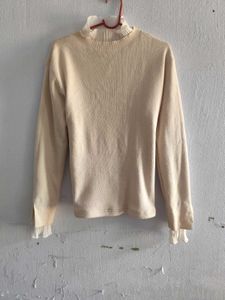 Elegant Knit Sweater with Ruffle Trim