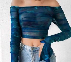 A blue off shoulder crop top