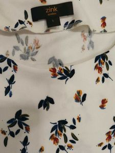 Looking for a trendy white top? Here it is