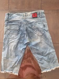 Distressed Light Wash Denim Capris