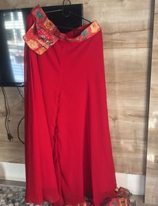 Red plazzo with stone work multi colour top