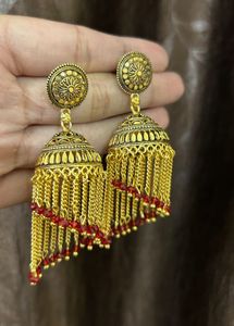 Exquisite Gold-Tone Jhumka Earrings with Red Beads