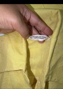 beige yellow shirt and heels