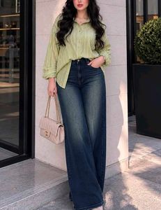 High-waisted, wide-leg denim jeans in a medium-to-