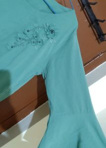 Aqua Green Top With Embroidery Design In The Front And Bell Sleeve