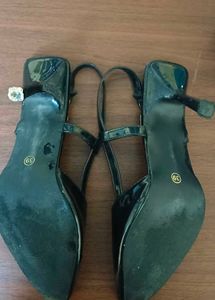 Black pointed heels with adjustable band