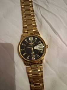 LOIS CARON Gold Pleated Watch For Men..