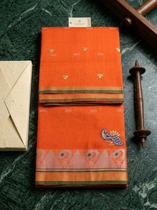 Vibrant Orange Saree with Peacock Motif