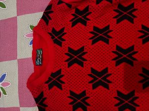 Red Knit Sweater with Black Geometric Pattern