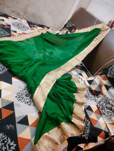 Elegant Emerald Green Saree with Gold Border