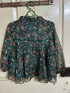 A green color floral print peplum top